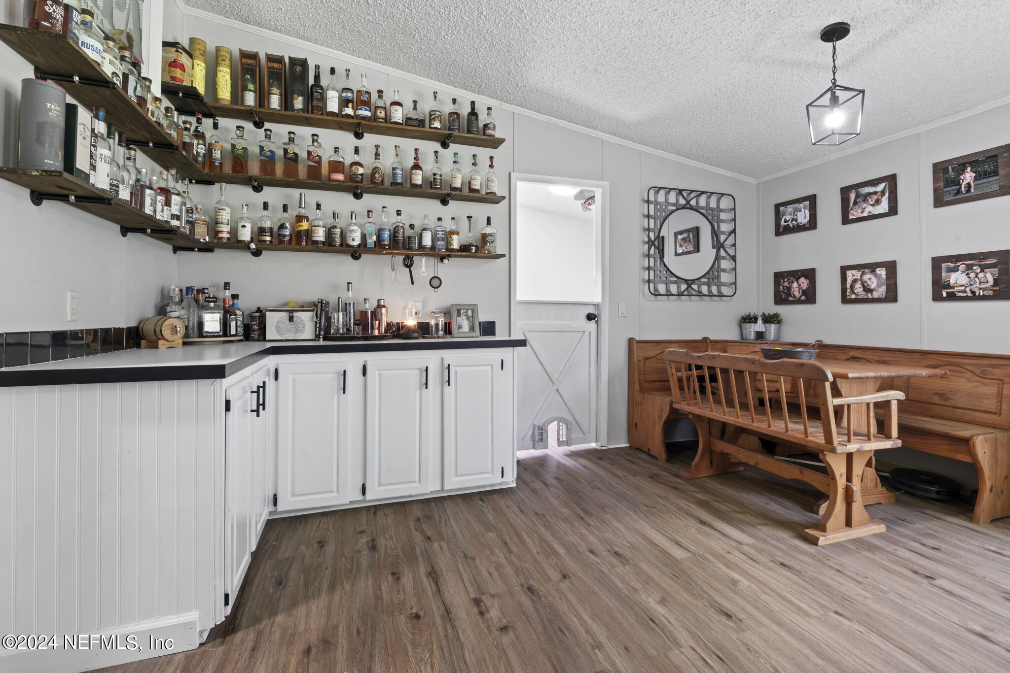 3809 Rancho Road Jacksonville, FL 32221 - Photo 22 of 69 a kitchen with a cabinets and wooden floor