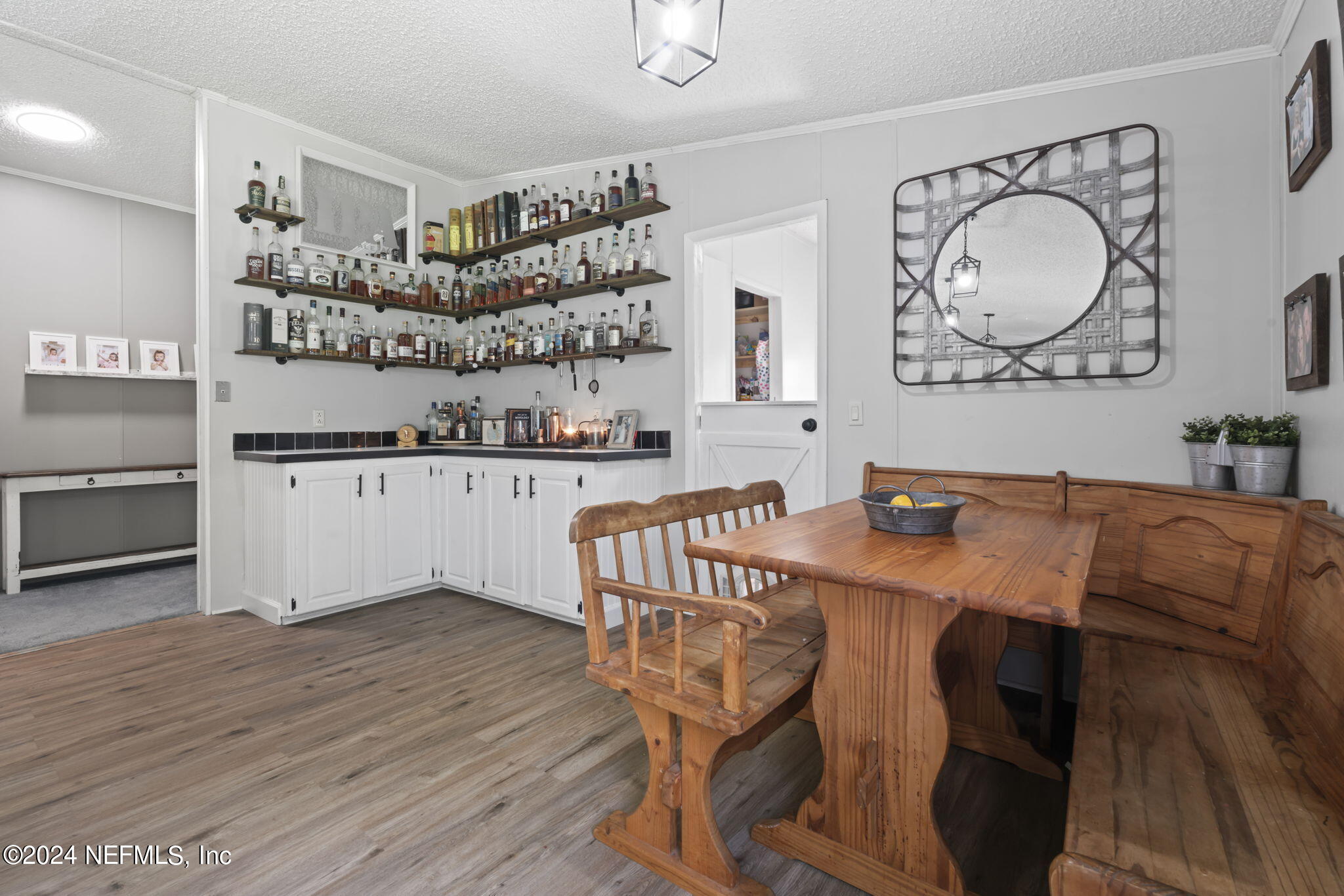3809 Rancho Road Jacksonville, FL 32221 - Photo 24 of 69 a view of a kitchen with a table and chairs