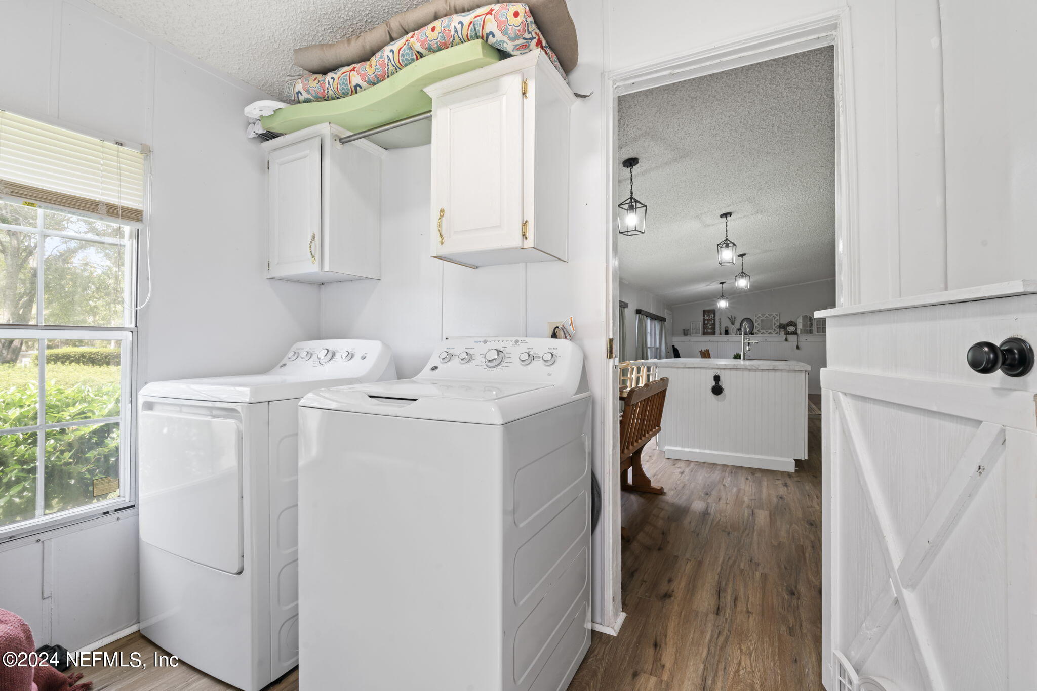 3809 Rancho Road Jacksonville, FL 32221 - Photo 25 of 69 a utility room with cabinets washer and dryer