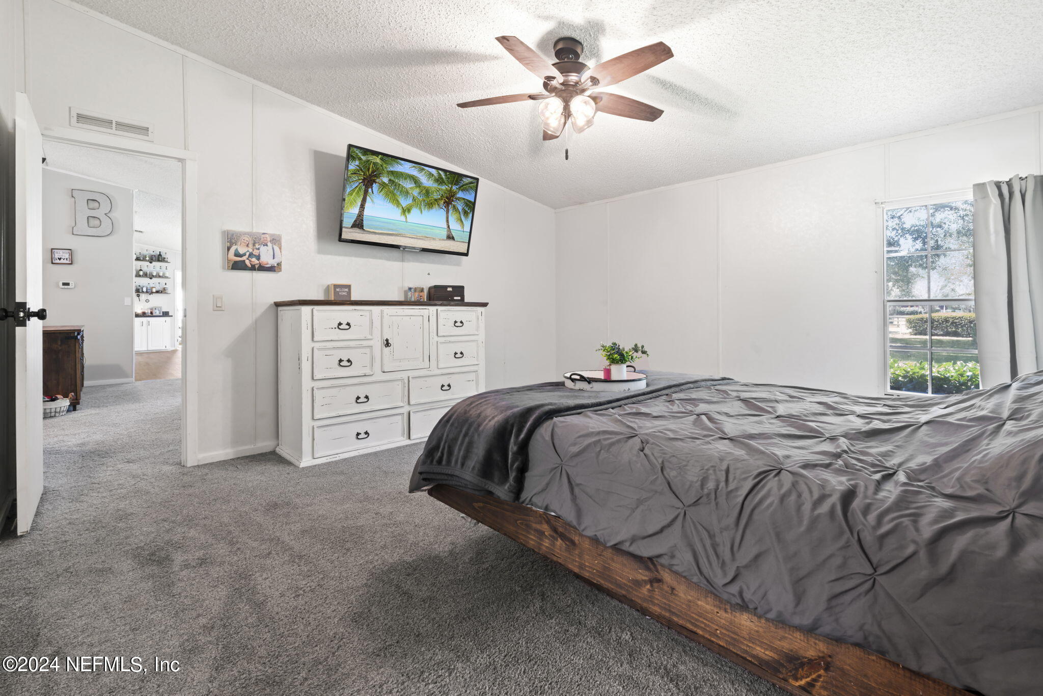 3809 Rancho Road Jacksonville, FL 32221 - Photo 26 of 69 a bedroom with a bed and a window