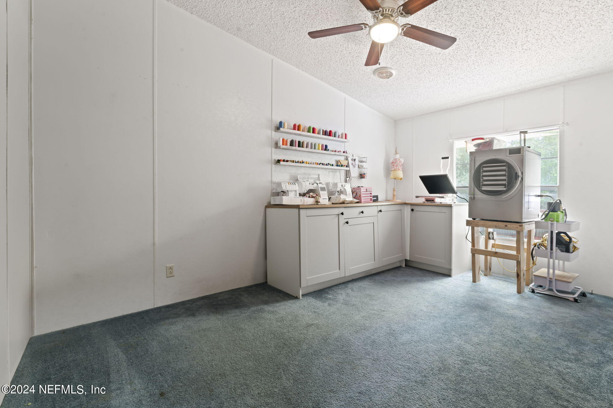 3809 Rancho Road Jacksonville, FL 32221 - Photo 33 of 69 a utility room with cabinets dryer and washer