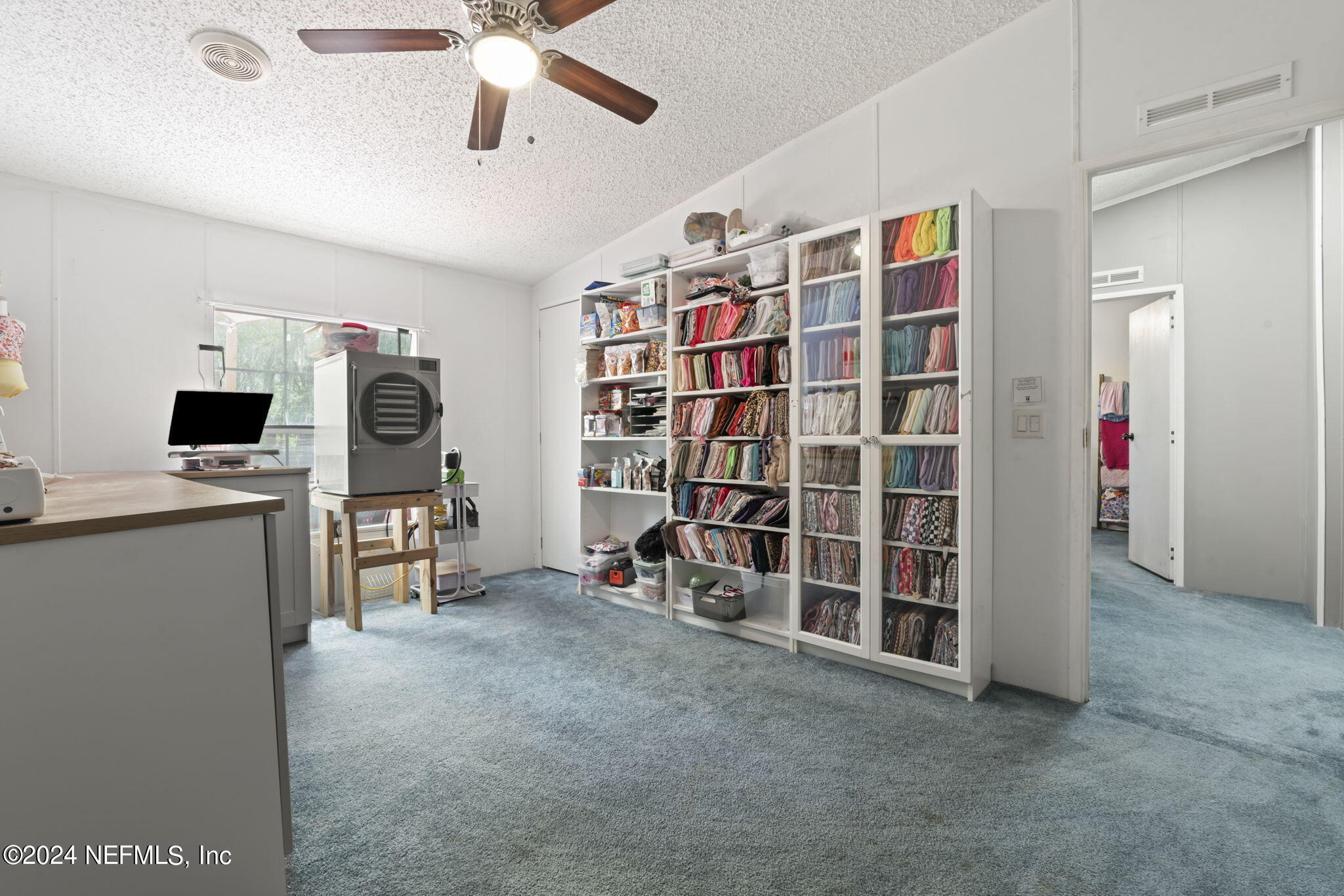 3809 Rancho Road Jacksonville, FL 32221 - Photo 34 of 69 a view of a livingroom with furniture and a ceiling fan