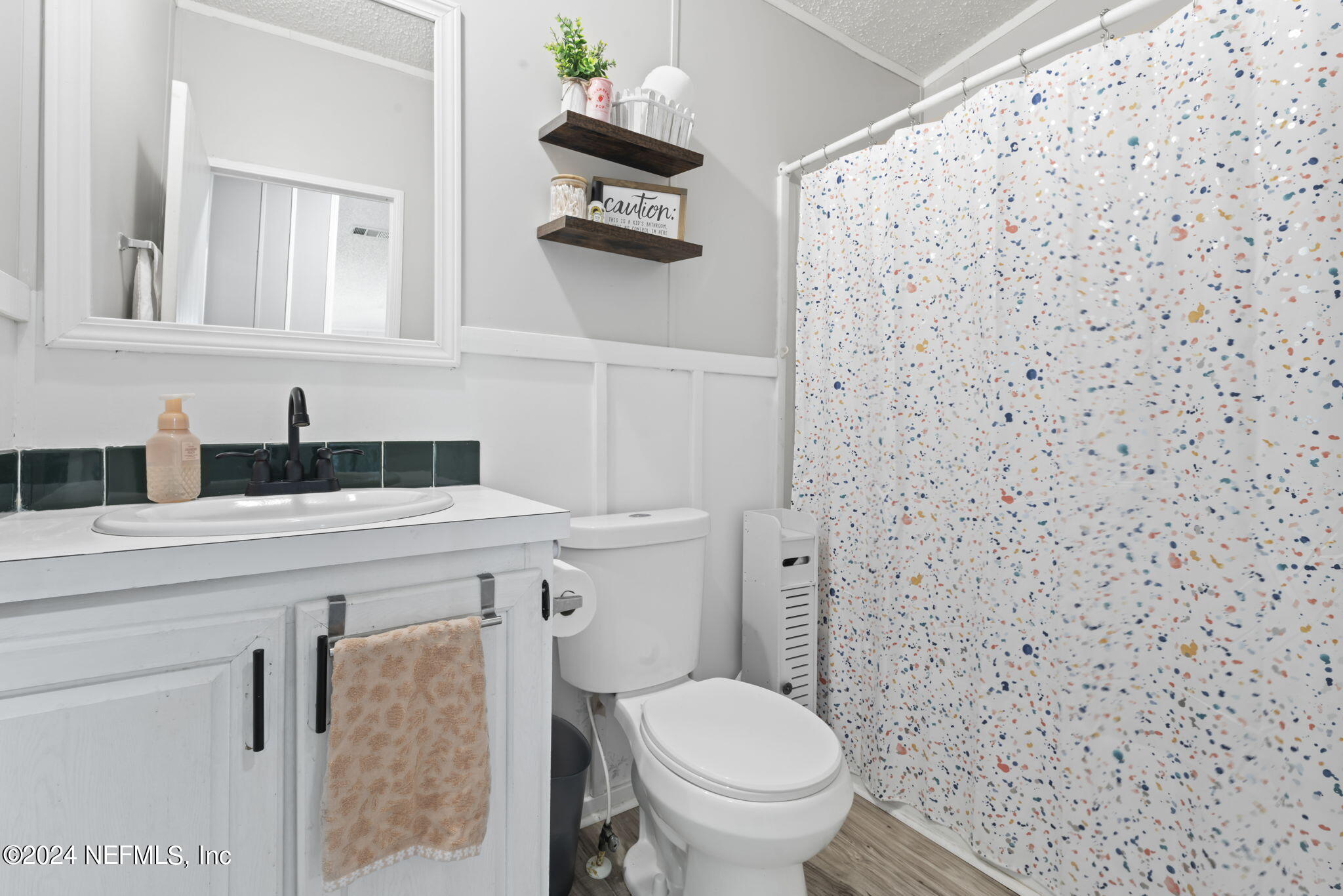 3809 Rancho Road Jacksonville, FL 32221 - Photo 35 of 69 a bathroom with a toilet and a sink