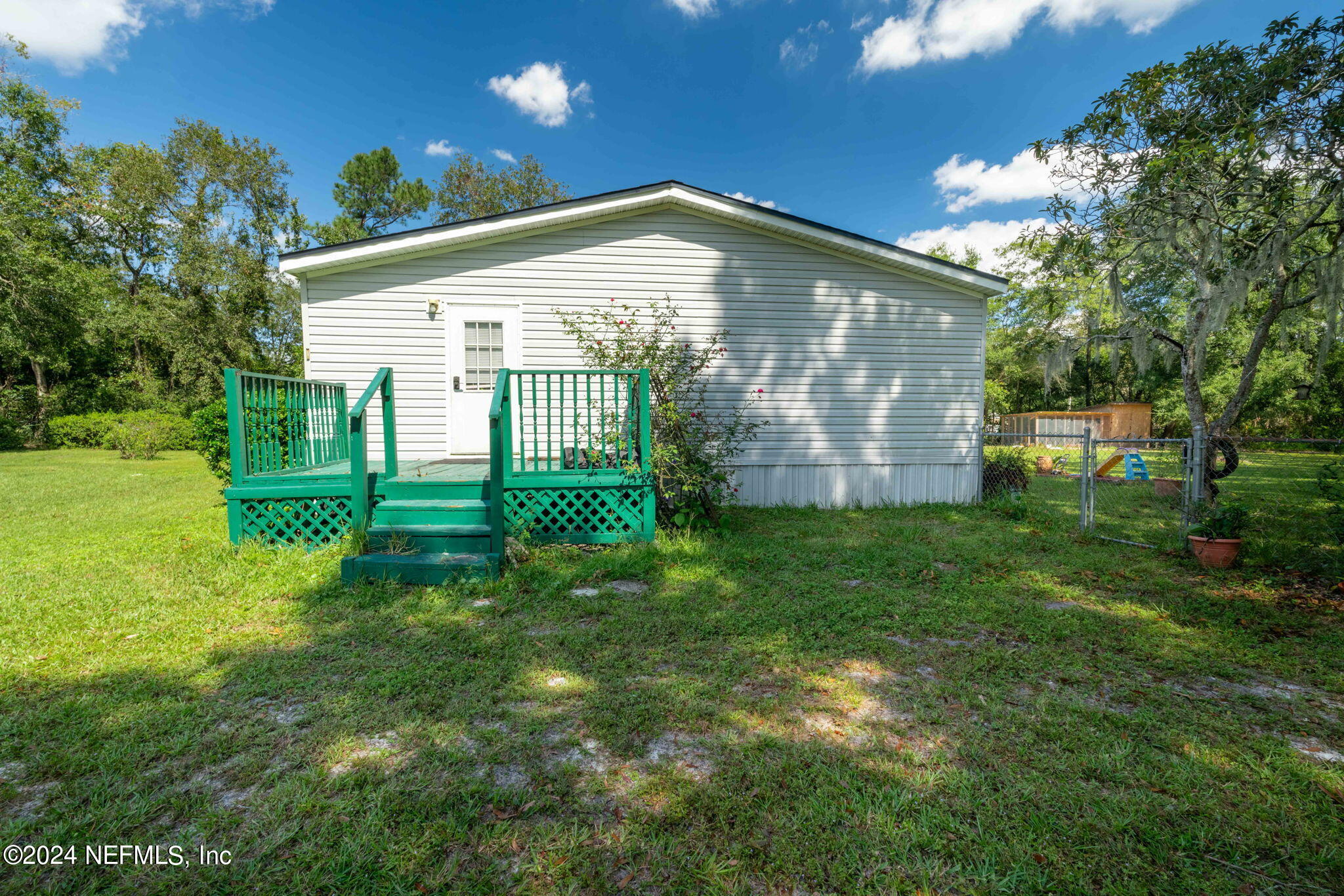 3809 Rancho Road Jacksonville, FL 32221 - Photo 39 of 69 a view of a house with a yard