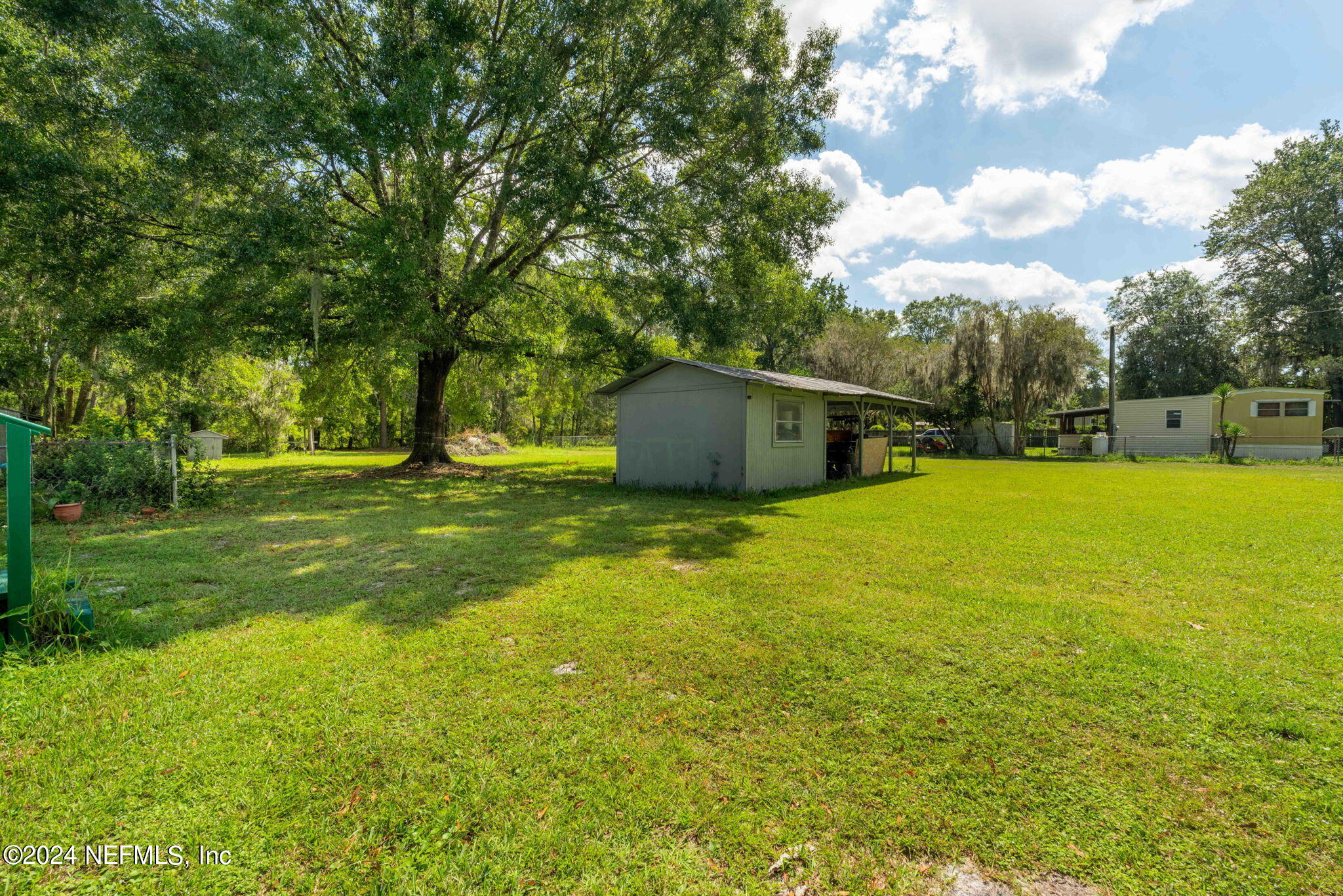 3809 Rancho Road Jacksonville, FL 32221 - Photo 40 of 69 a view of a swimming pool with an outdoor and seating area