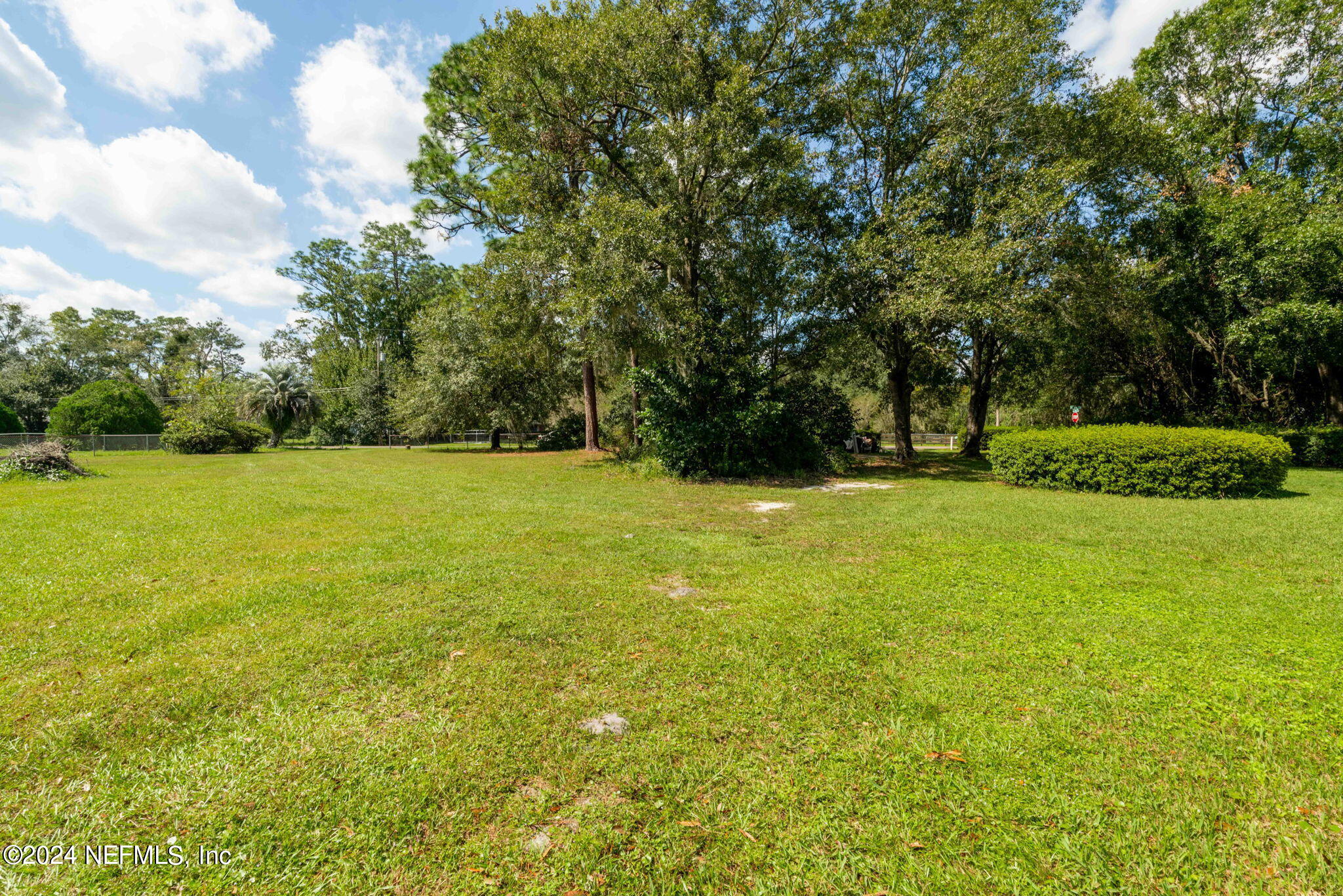3809 Rancho Road Jacksonville, FL 32221 - Photo 41 of 69 a view of yard with swimming pool and green space
