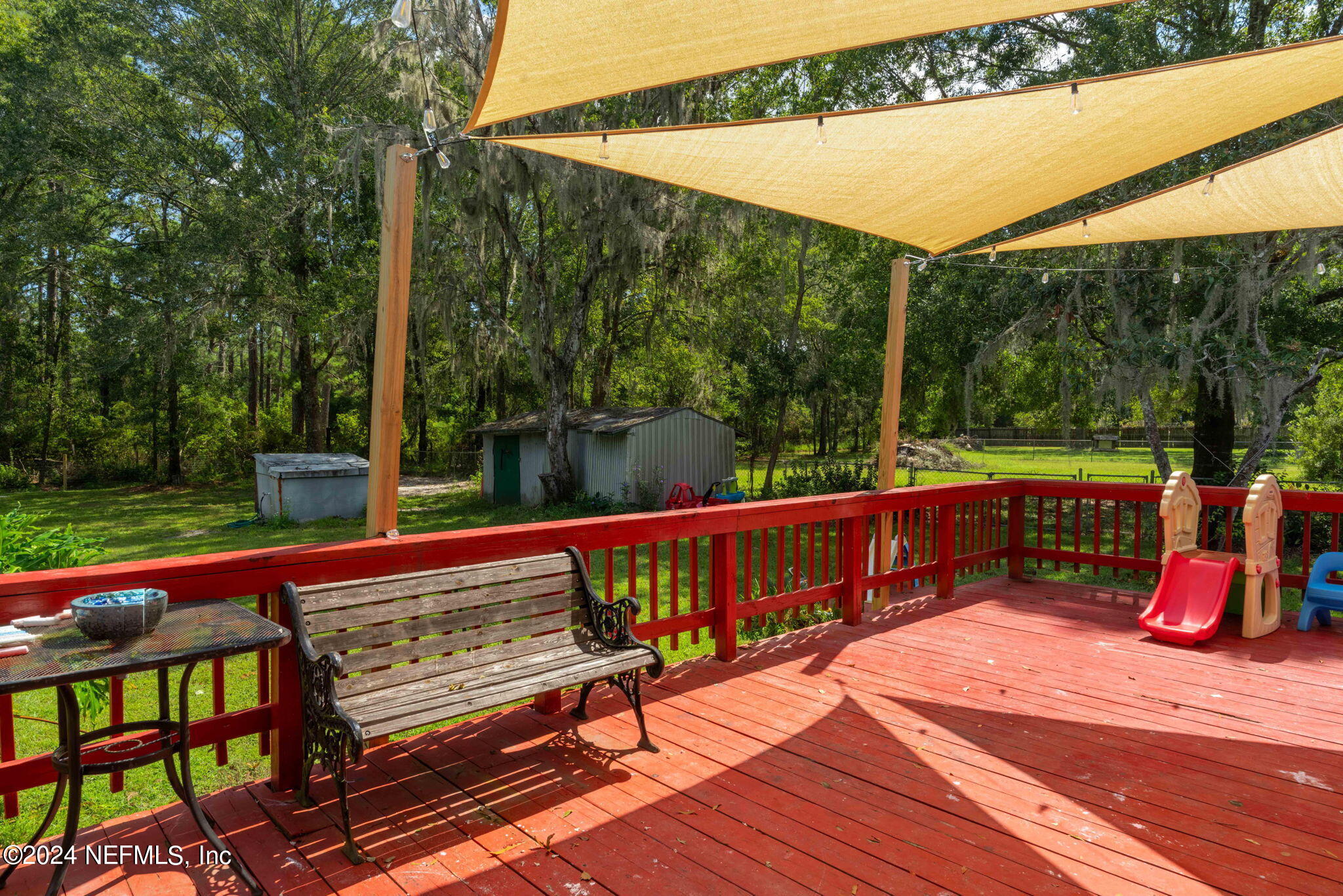 3809 Rancho Road Jacksonville, FL 32221 - Photo 47 of 69 a view of a chairs and tables in the patio
