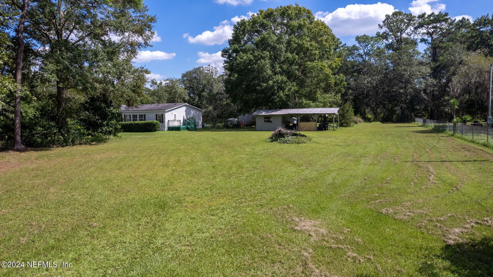 3809 Rancho Road Jacksonville, FL 32221 - Photo 51 of 69 a house with trees in front of it