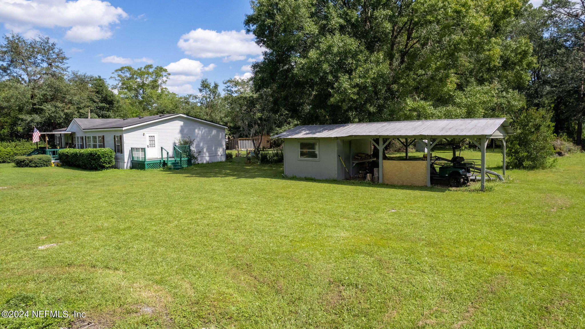 3809 Rancho Road Jacksonville, FL 32221 - Photo 52 of 69 a view of a house with backyard porch and garden
