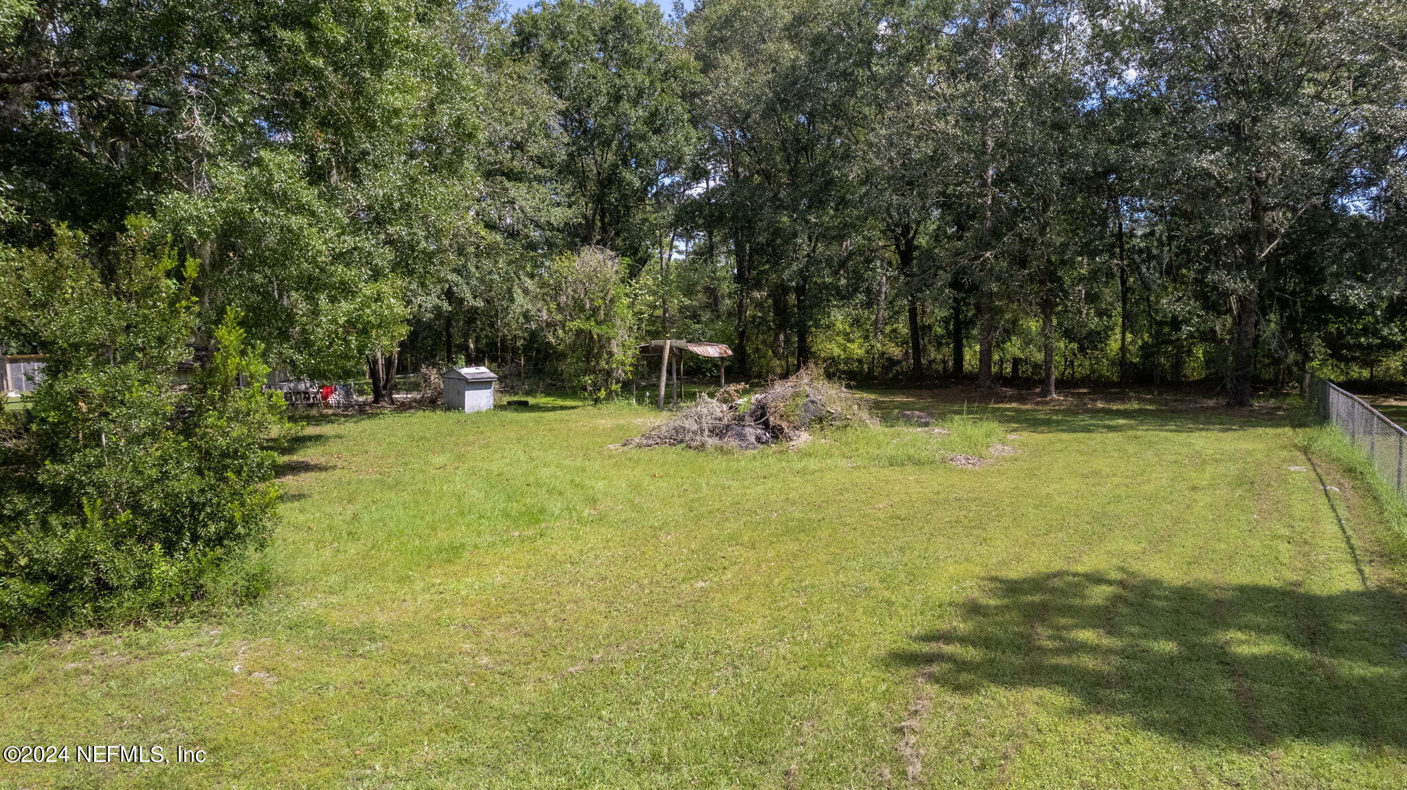 3809 Rancho Road Jacksonville, FL 32221 - Photo 53 of 69 a view of a swimming pool and lounge chairs