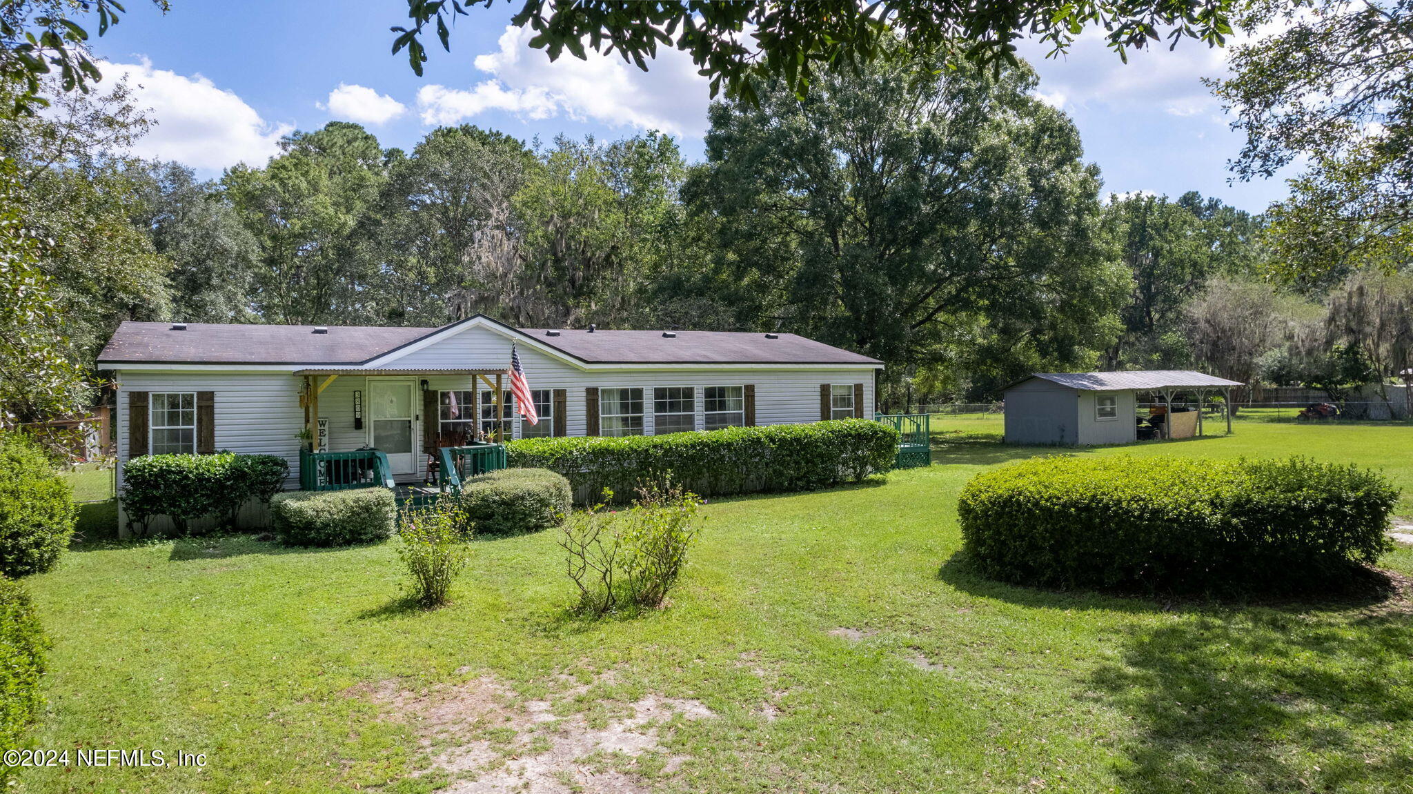 3809 Rancho Road Jacksonville, FL 32221 - Photo 56 of 69 a front view of house with yard and green space