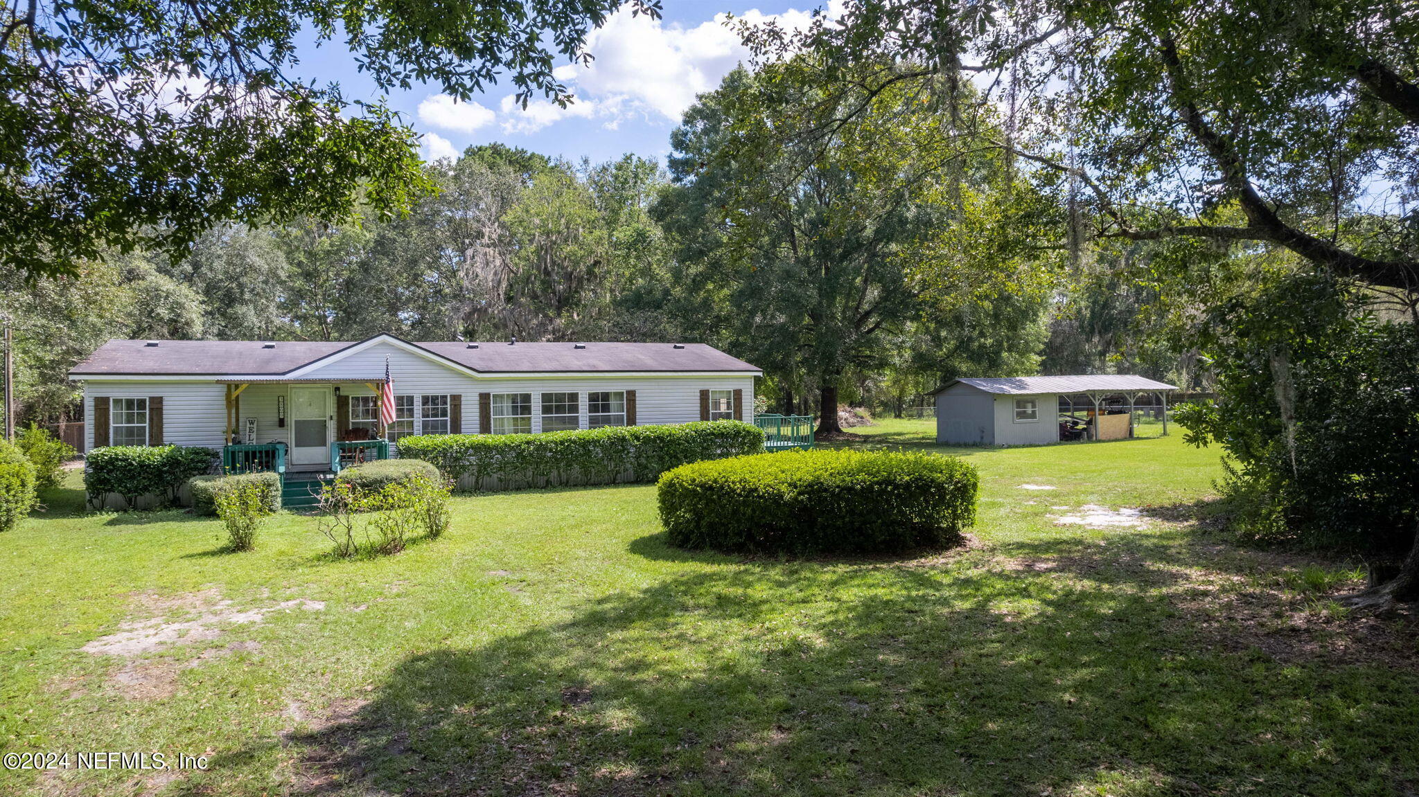 3809 Rancho Road Jacksonville, FL 32221 - Photo 57 of 69 a front view of a house with garden