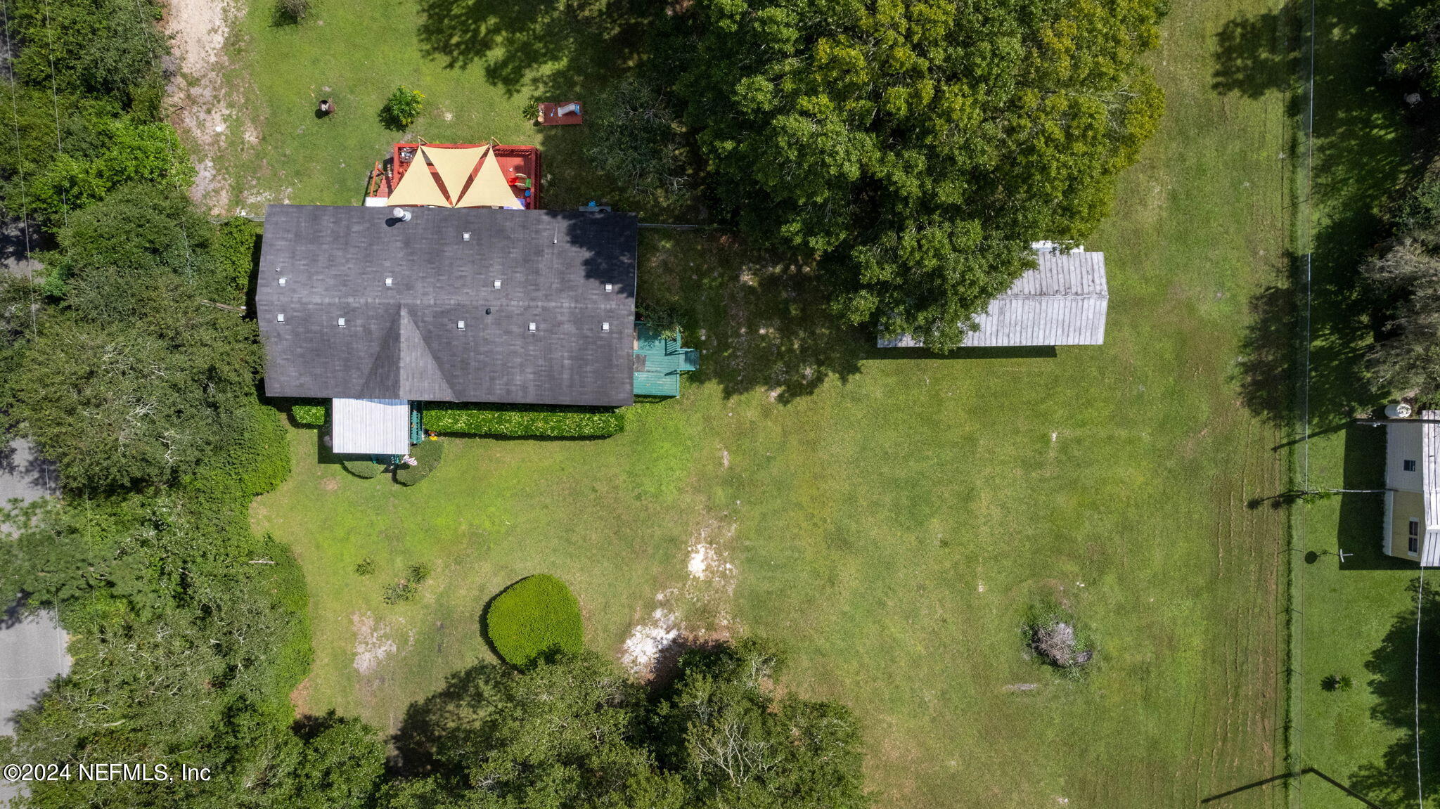 3809 Rancho Road Jacksonville, FL 32221 - Photo 66 of 69 an aerial view of a house with a swimming pool outdoor seating and yard