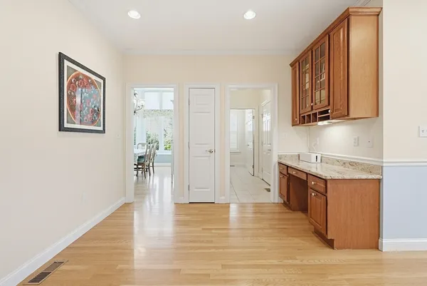 a view of a kitchen cabinets and wooden floor