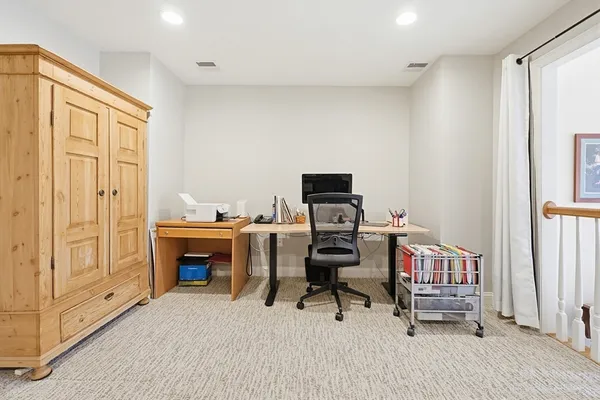 a reading room with furniture and a window