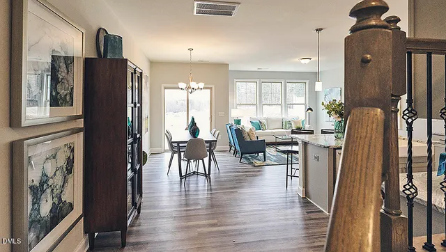 a kitchen with granite countertop white cabinets and a sink