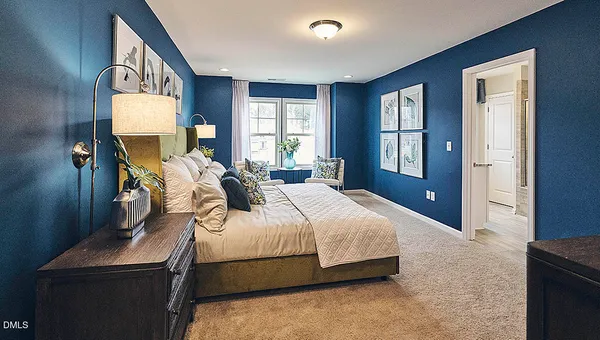 a view of a livingroom with furniture window and wooden floor