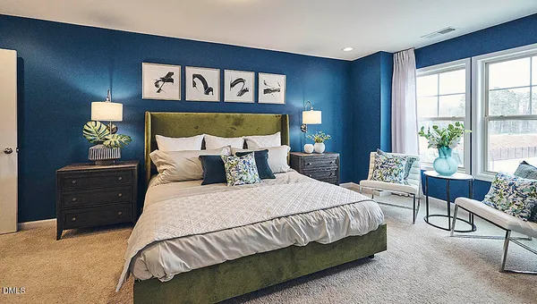 a bed room with a bed and a lamp