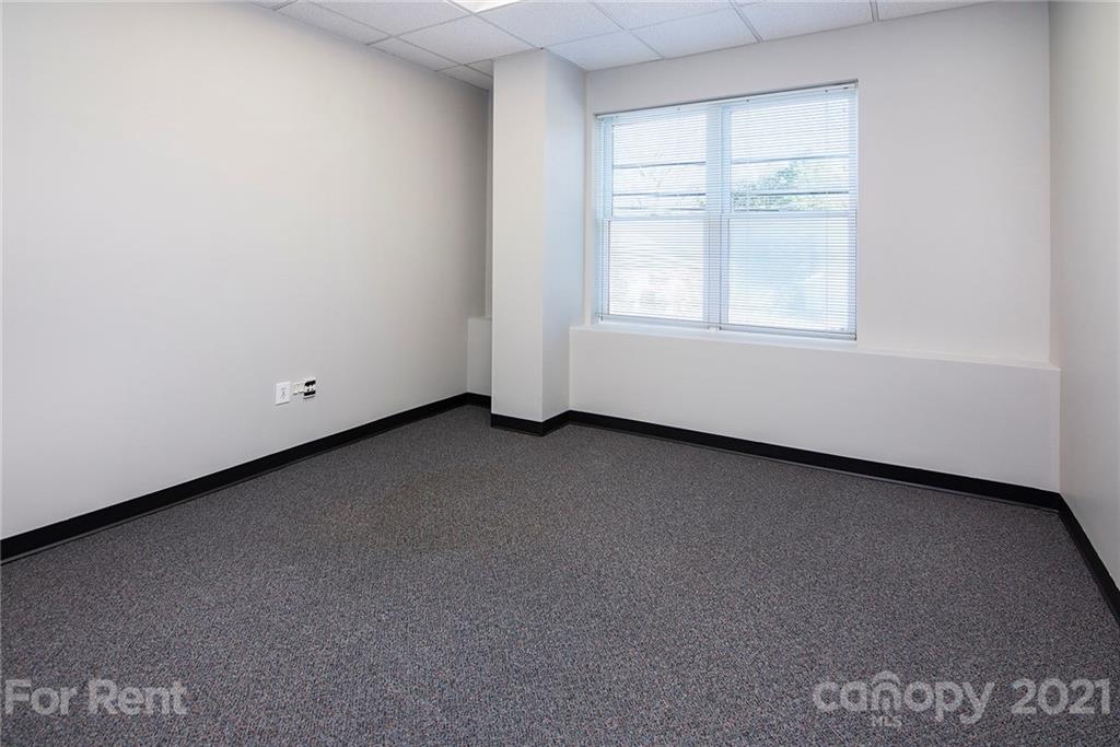 442 South Main Street, Unit 22 Davidson, NC 28036 - Photo 9 of 25 a view of an empty room with a window