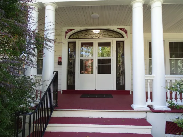 a front view of a house with a porch