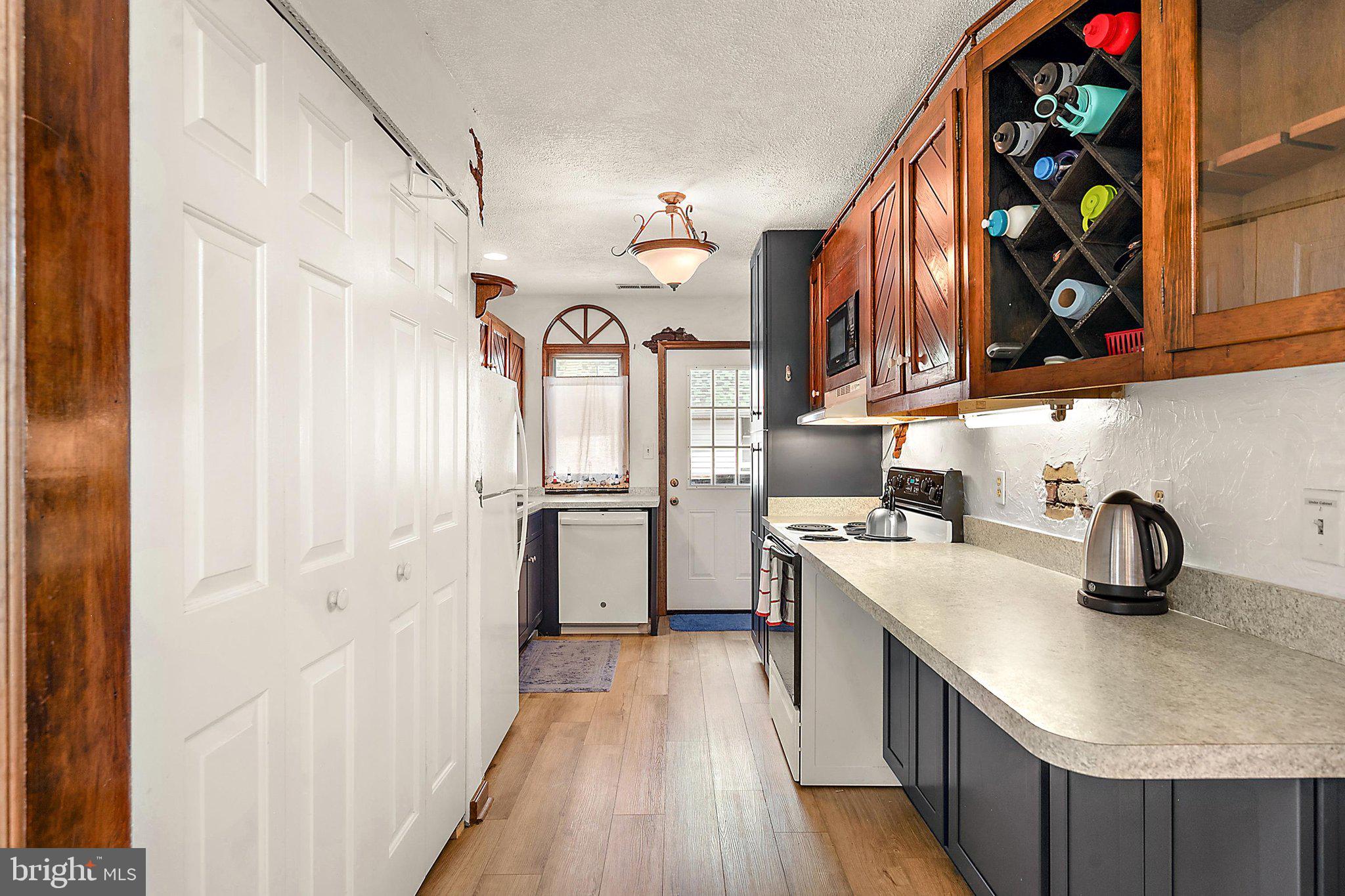 148 Jamestown Road Ocean City, MD 21842 - Photo 61 of 82 Upstairs Apt Kitchen with Door to Deck