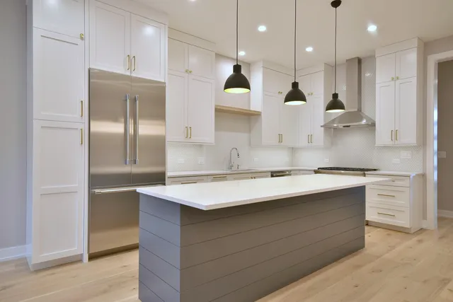 a kitchen with a stove and a sink