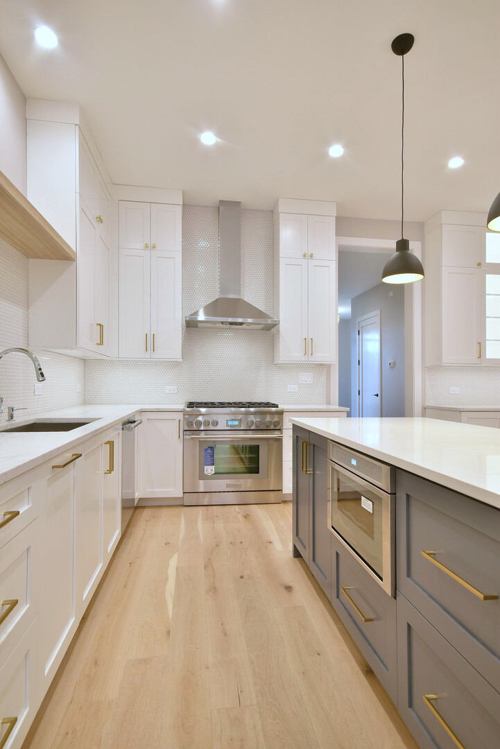 258 North Addison Avenue Elmhurst, IL 60126 - Photo 4 of 13 a kitchen with stainless steel appliances granite countertop a sink a stove and a refrigerator