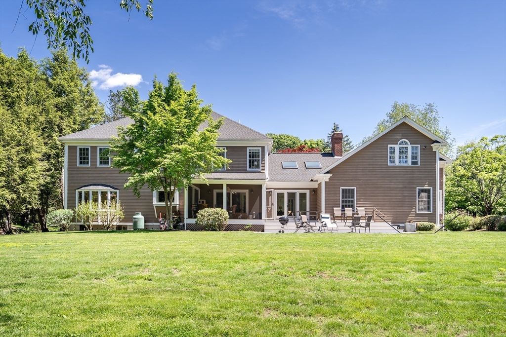 34 Solomon Pierce Road Lexington, MA 02420 - Photo 38 of 42 a front view of a house with garden and trees