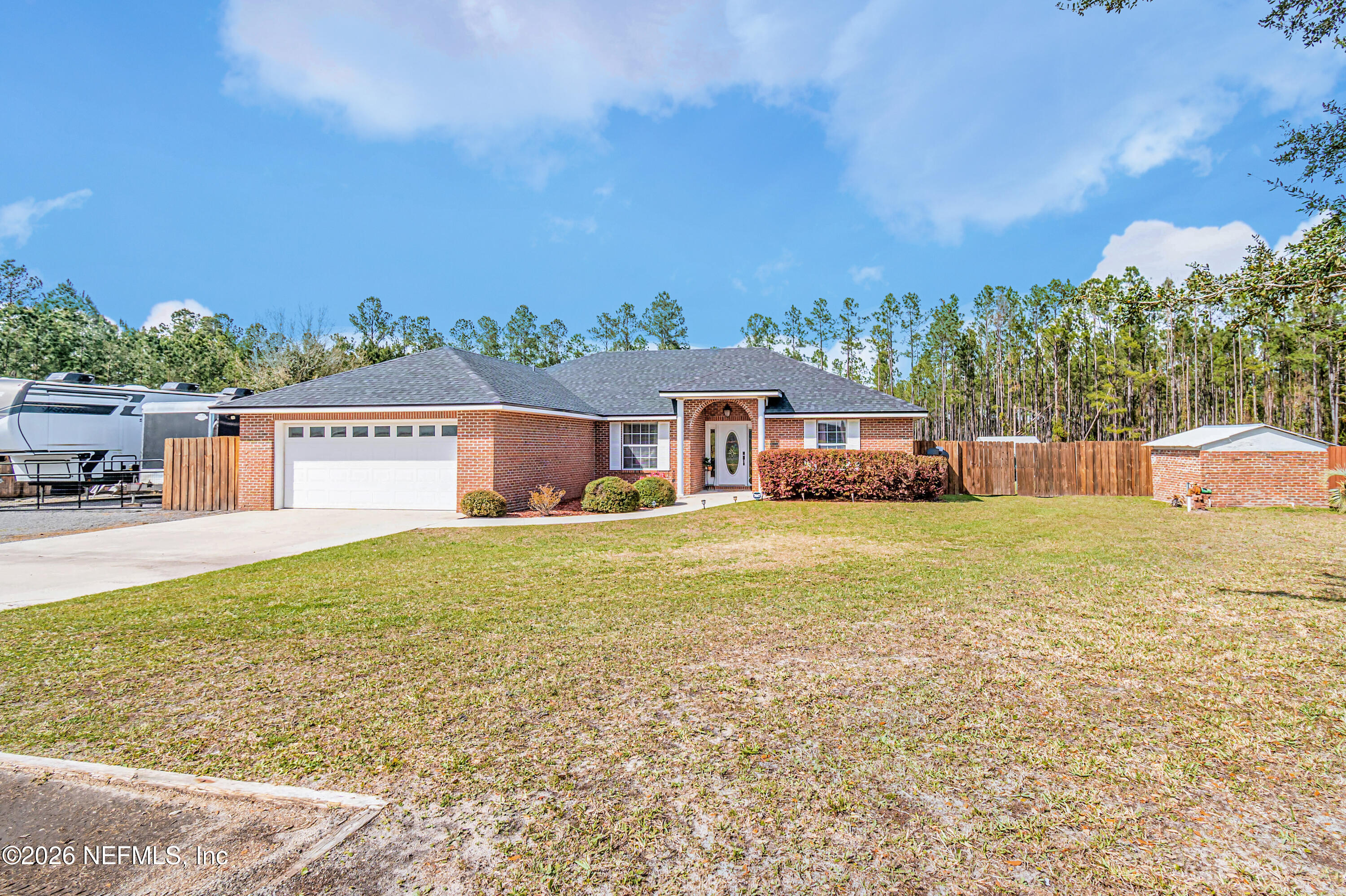 7667 Odis Yarborough Road Glen St. Mary, FL 32040 - Photo 1 of 40 a view of house with outdoor space and swimming pool