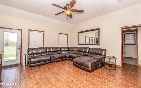 a living room with furniture and a large window
