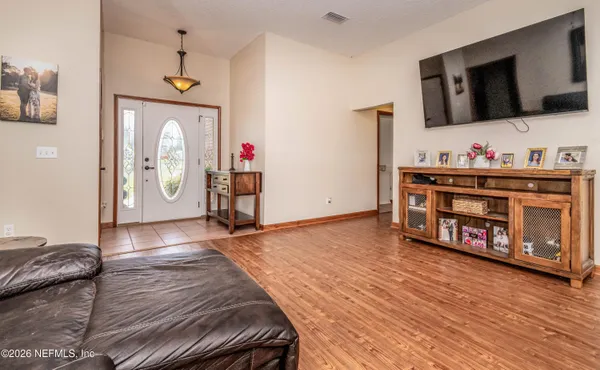 a view of living room with furniture and flat screen tv