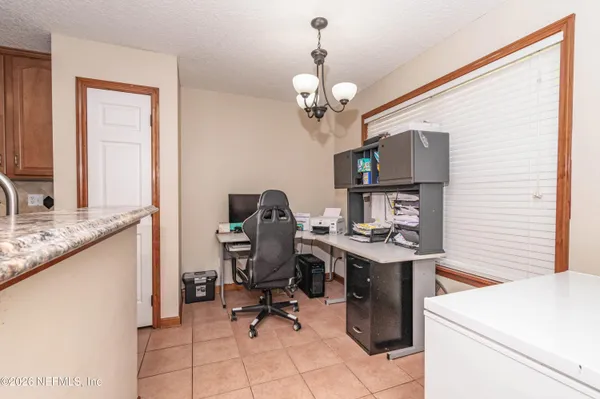 a view of a workspace with furniture