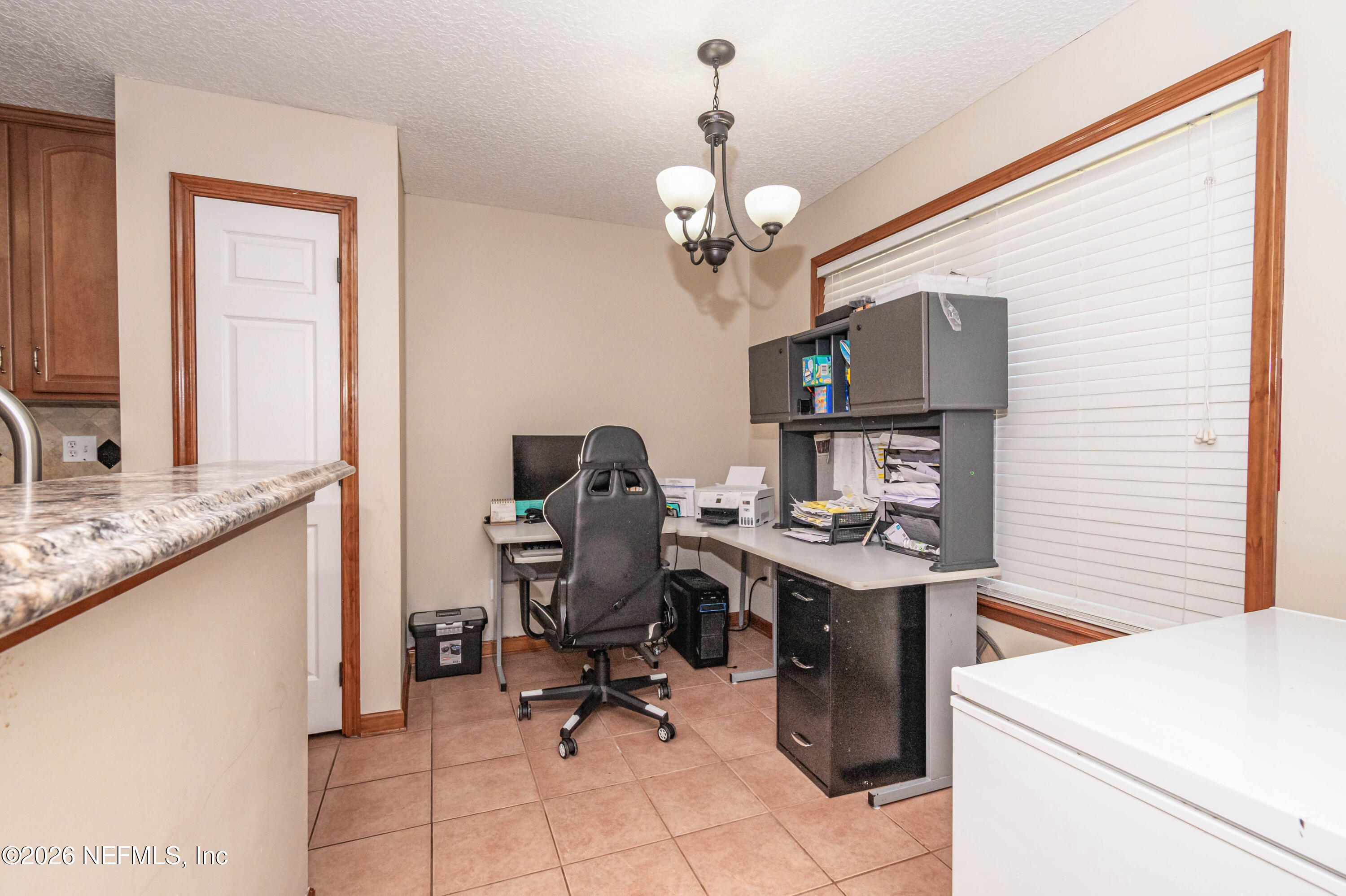 7667 Odis Yarborough Road Glen St. Mary, FL 32040 - Photo 20 of 40 a view of a workspace with furniture