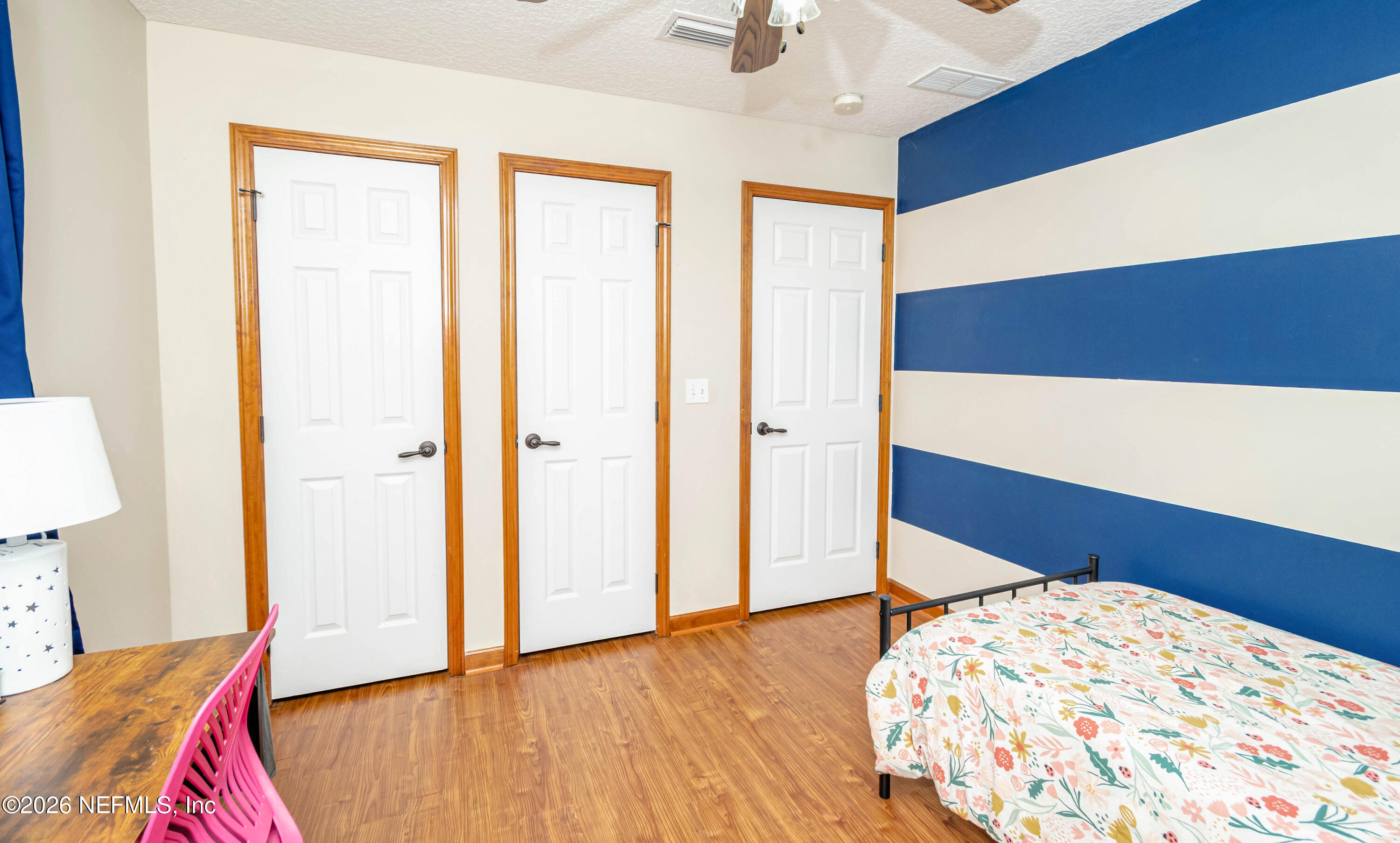 7667 Odis Yarborough Road Glen St. Mary, FL 32040 - Photo 29 of 40 a bedroom with a bed and a dresser