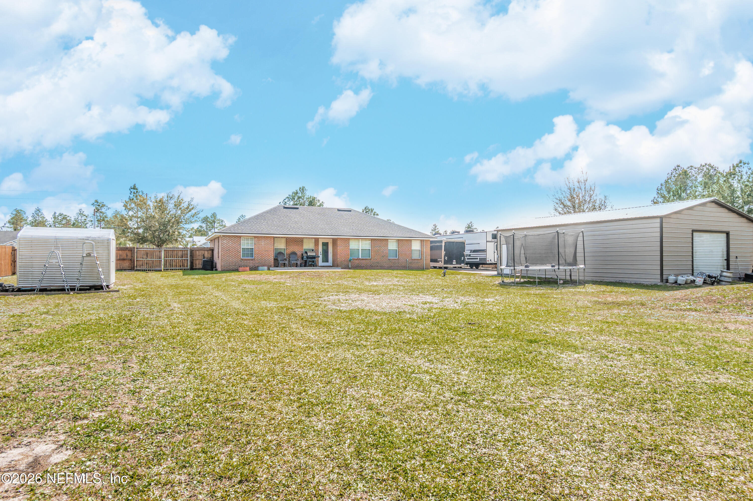 7667 Odis Yarborough Road Glen St. Mary, FL 32040 - Photo 31 of 40 a front view of a house with a garden