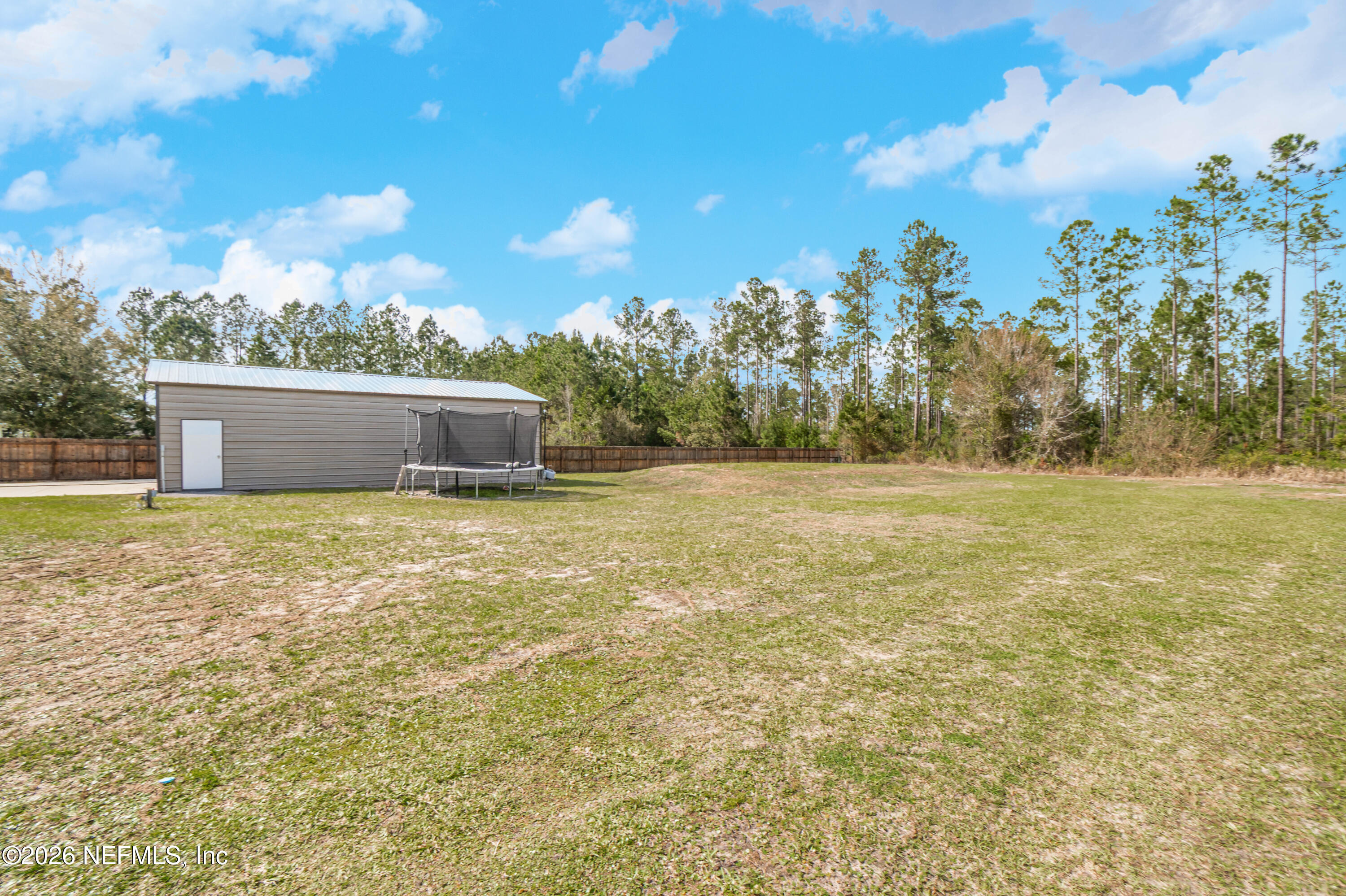7667 Odis Yarborough Road Glen St. Mary, FL 32040 - Photo 35 of 40 a view of a yard with an outdoor space