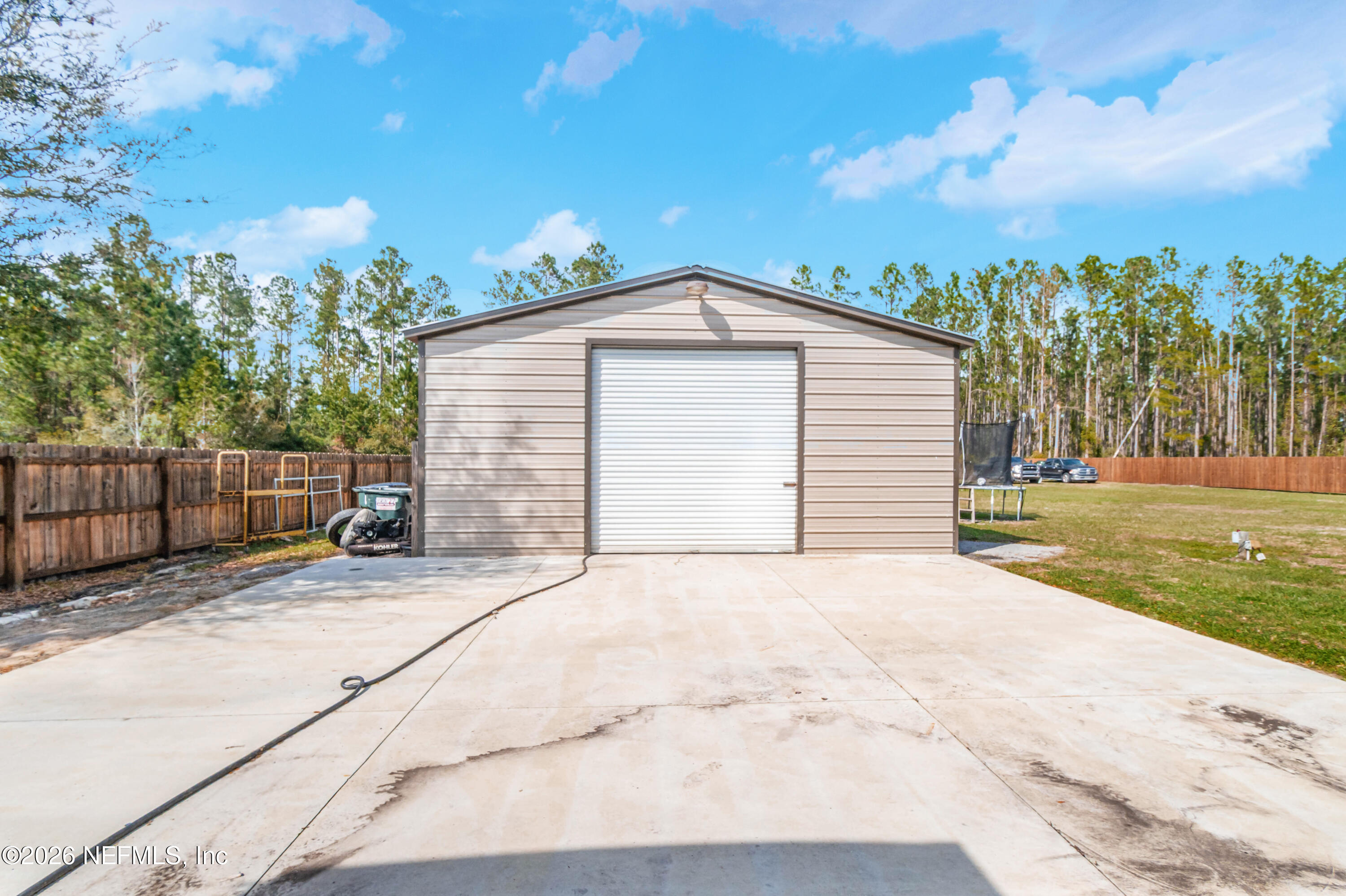 7667 Odis Yarborough Road Glen St. Mary, FL 32040 - Photo 37 of 40 a view of backyard of house with green space