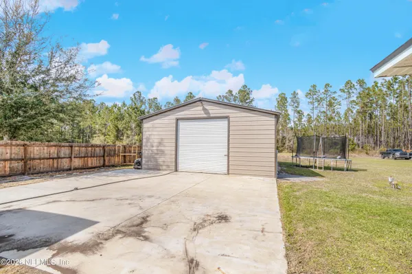 a view of a backyard of the house
