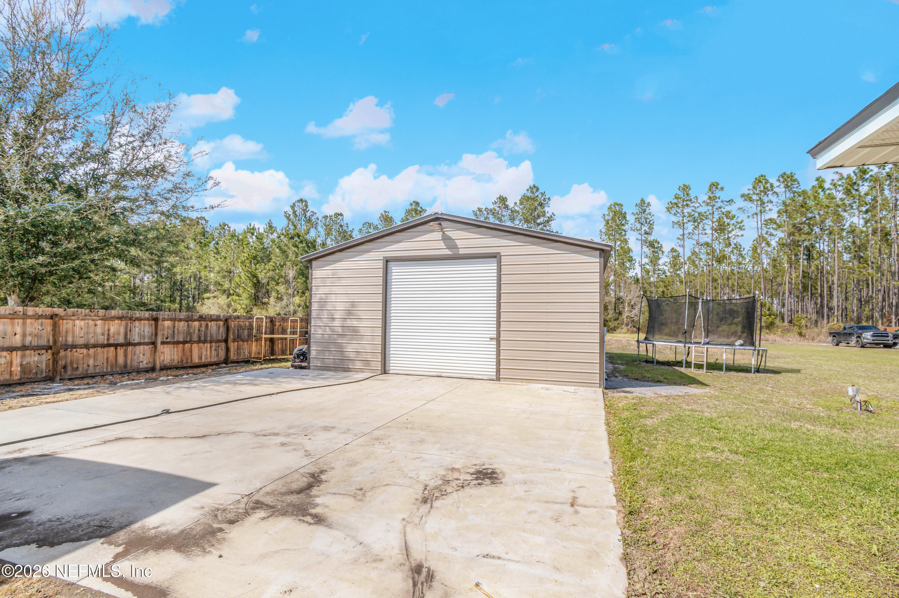 7667 Odis Yarborough Road Glen St. Mary, FL 32040 - Photo 38 of 40 a view of a backyard of the house