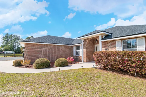 a view of a backyard of the house