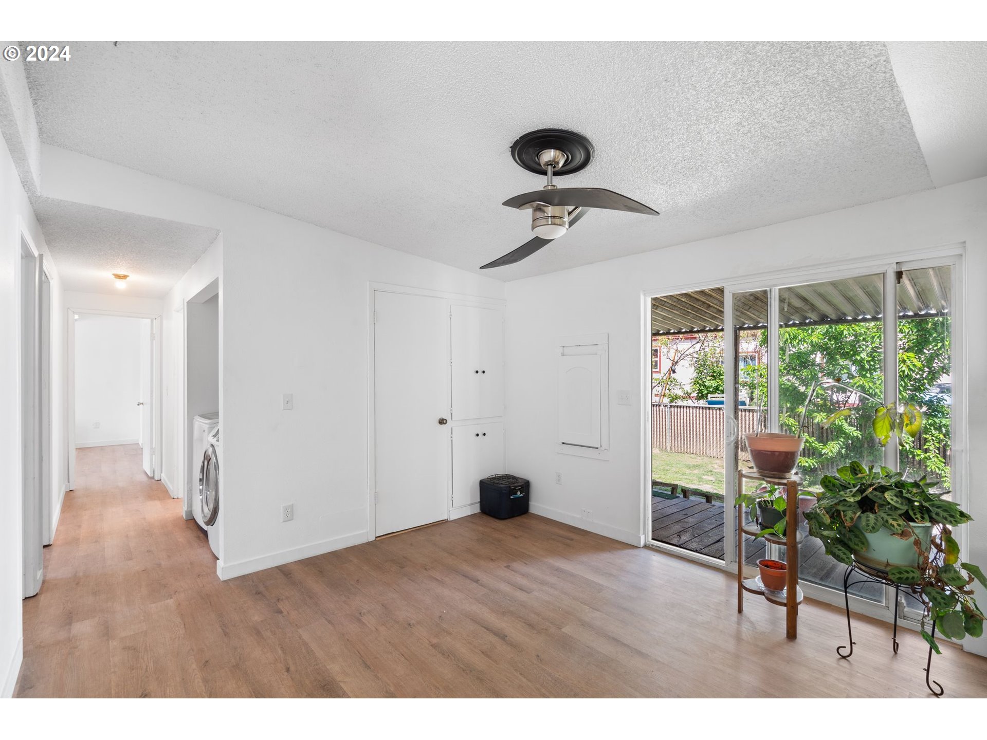 10038 South New Era Road, Unit 98 Canby, OR 97013 - Photo 13 of 34 a view of empty room with wooden floor and fan