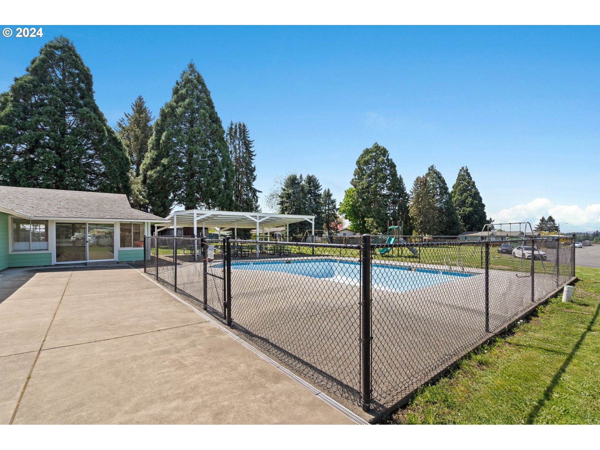 10038 South New Era Road, Unit 98 Canby, OR 97013 - Photo 34 of 34 a view of a swimming pool with a yard