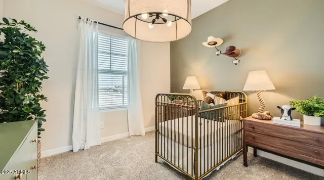 a bathroom with a shower curtain and a window