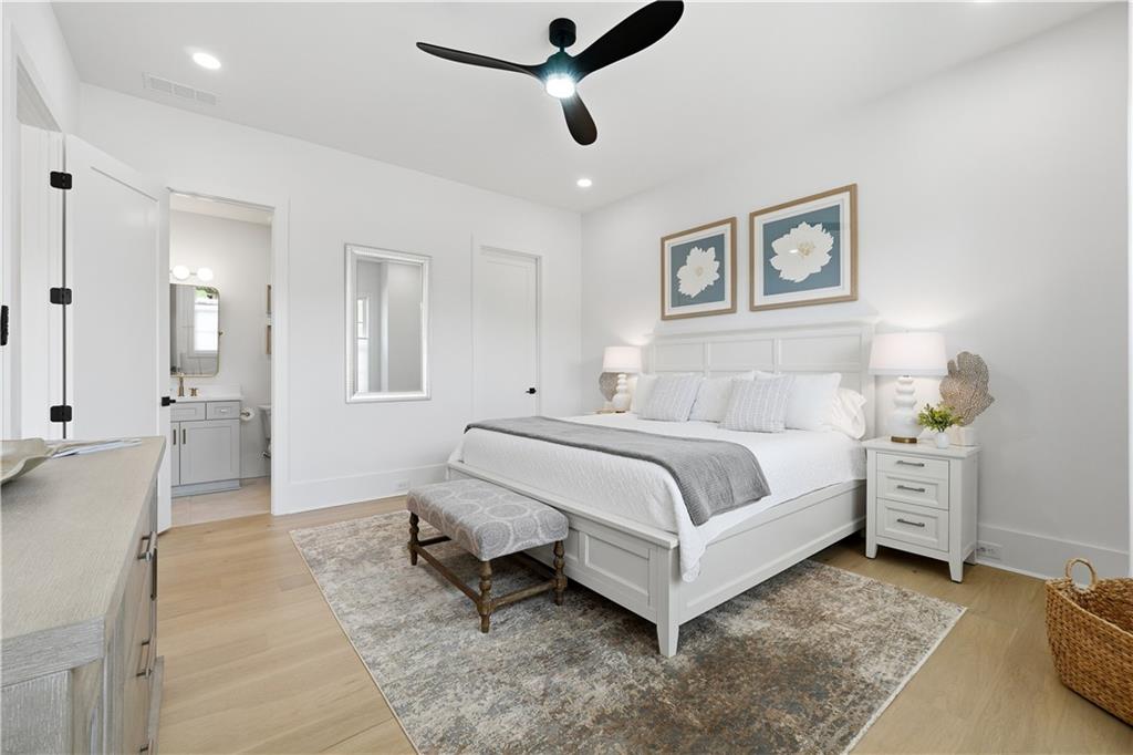 237 Lask Lane Milton, GA 30004 - Photo 27 of 63 a bedroom with a bed and a chandelier