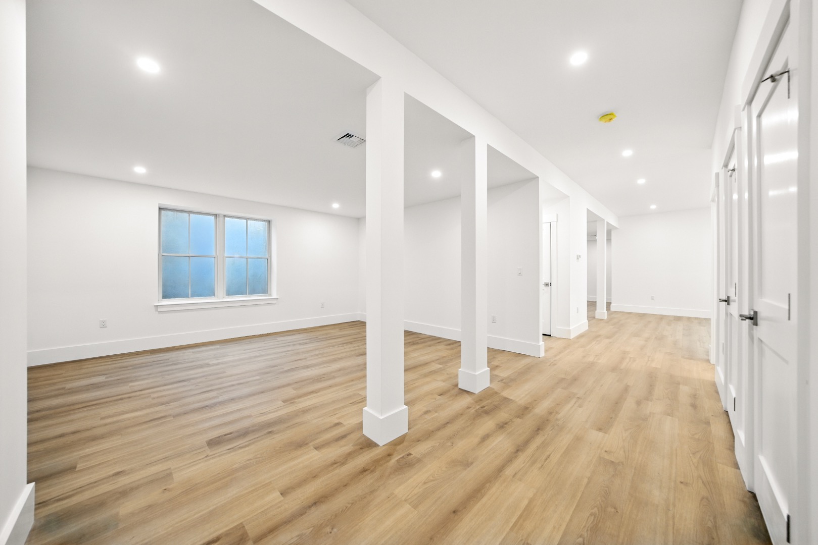 10 Beach Grass Road Nantucket, MA 02554 - Photo 22 of 29 a view of an empty room with wooden floor