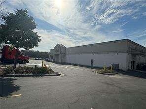2949 Rosebud Road Loganville, GA 30052 - Photo 19 of 42 a backyard of a house with table and chairs