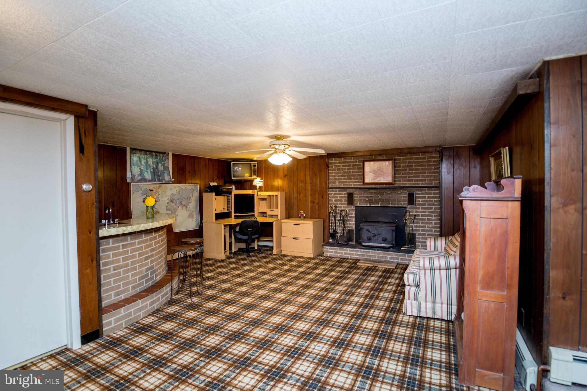 670 Riegelsville Milford Road Milford, NJ 08848 - Photo 18 of 26 Den with Wet Bar, Full Bath & Wood Stove