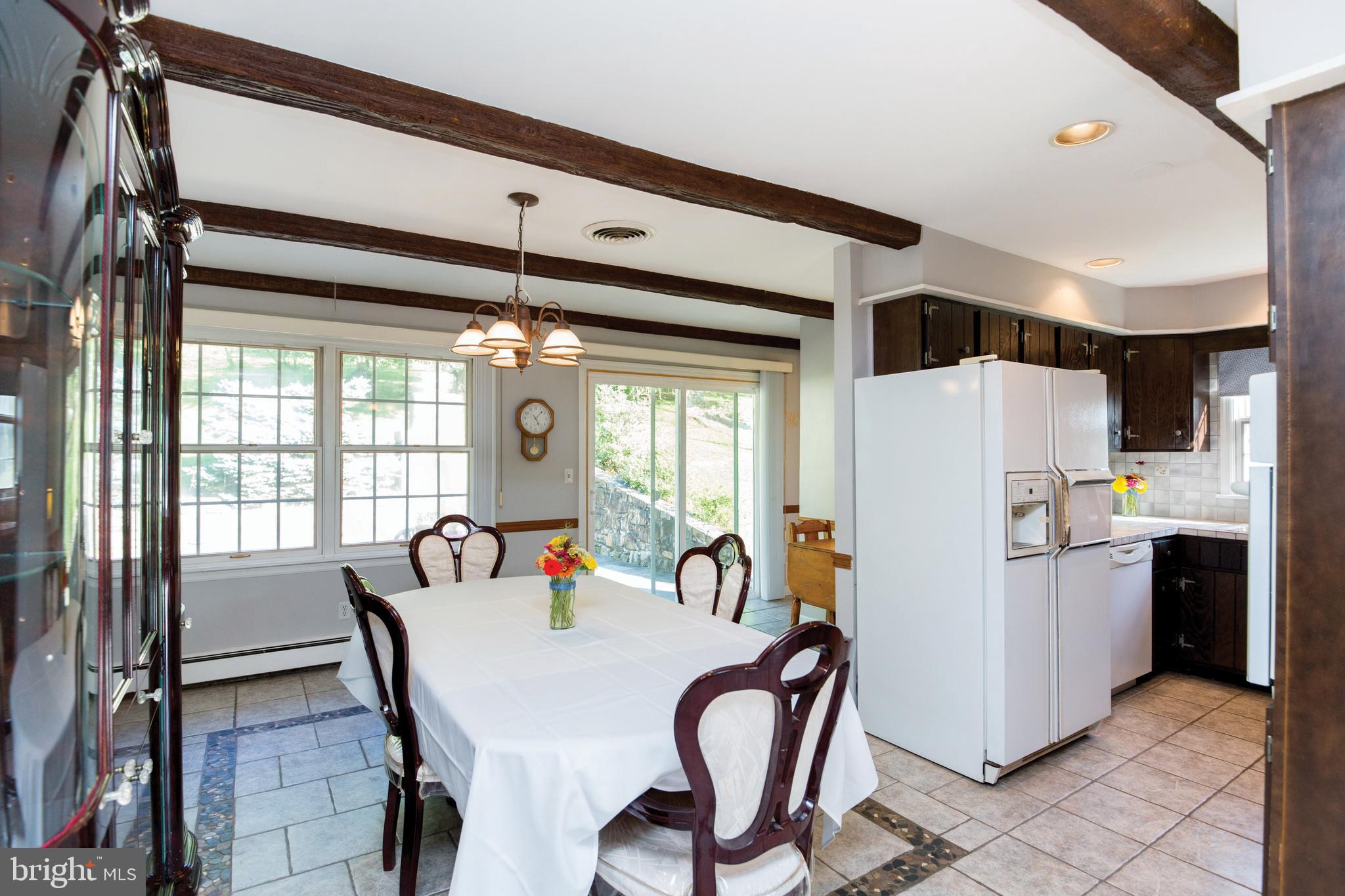 670 Riegelsville Milford Road Milford, NJ 08848 - Photo 8 of 26 Dining Room into the Kitchen & out to the patio