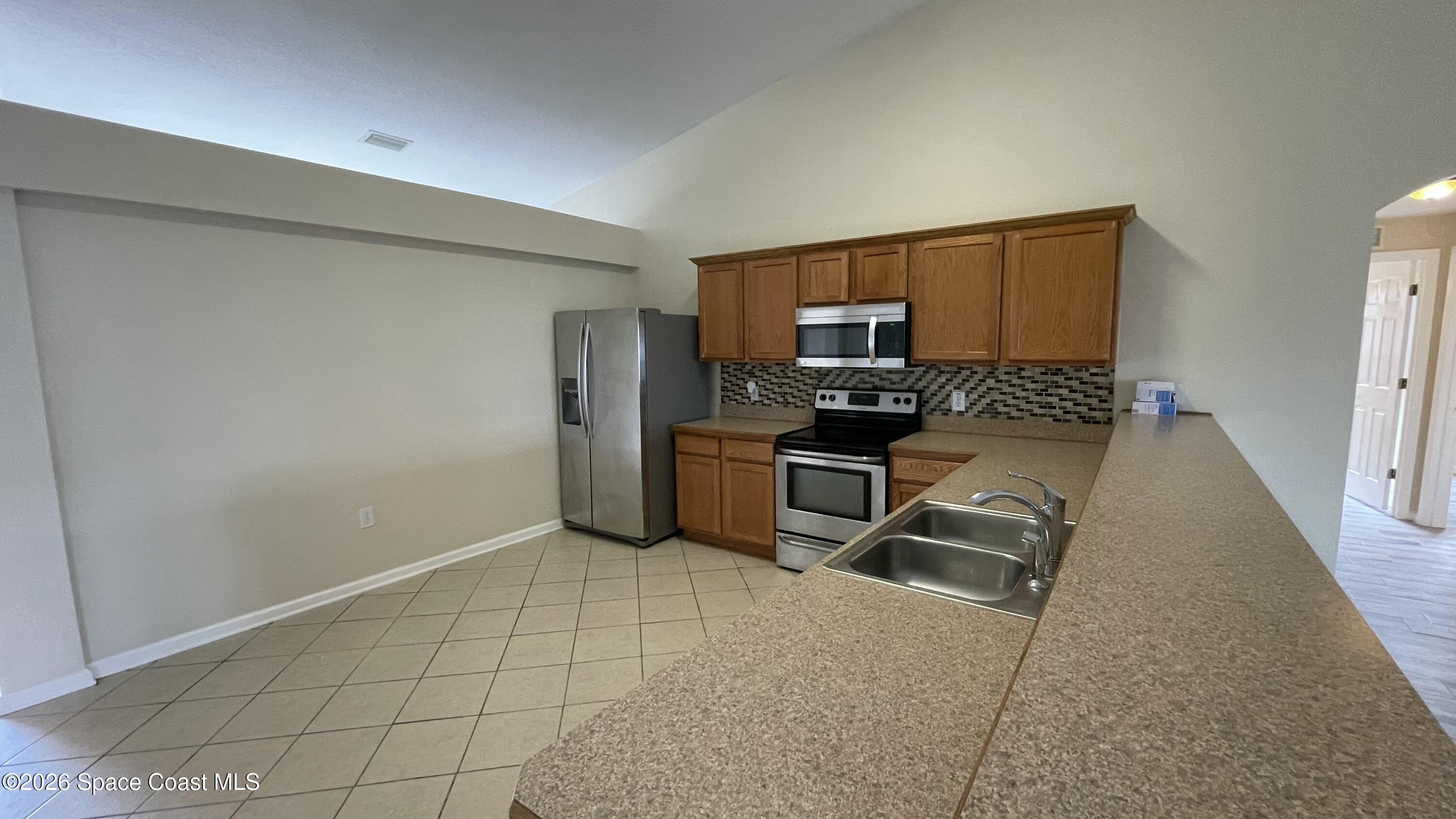 415 Oakmon Road Southwest Palm Bay, FL 32908 - Photo 29 of 61 Step up breakfast bar