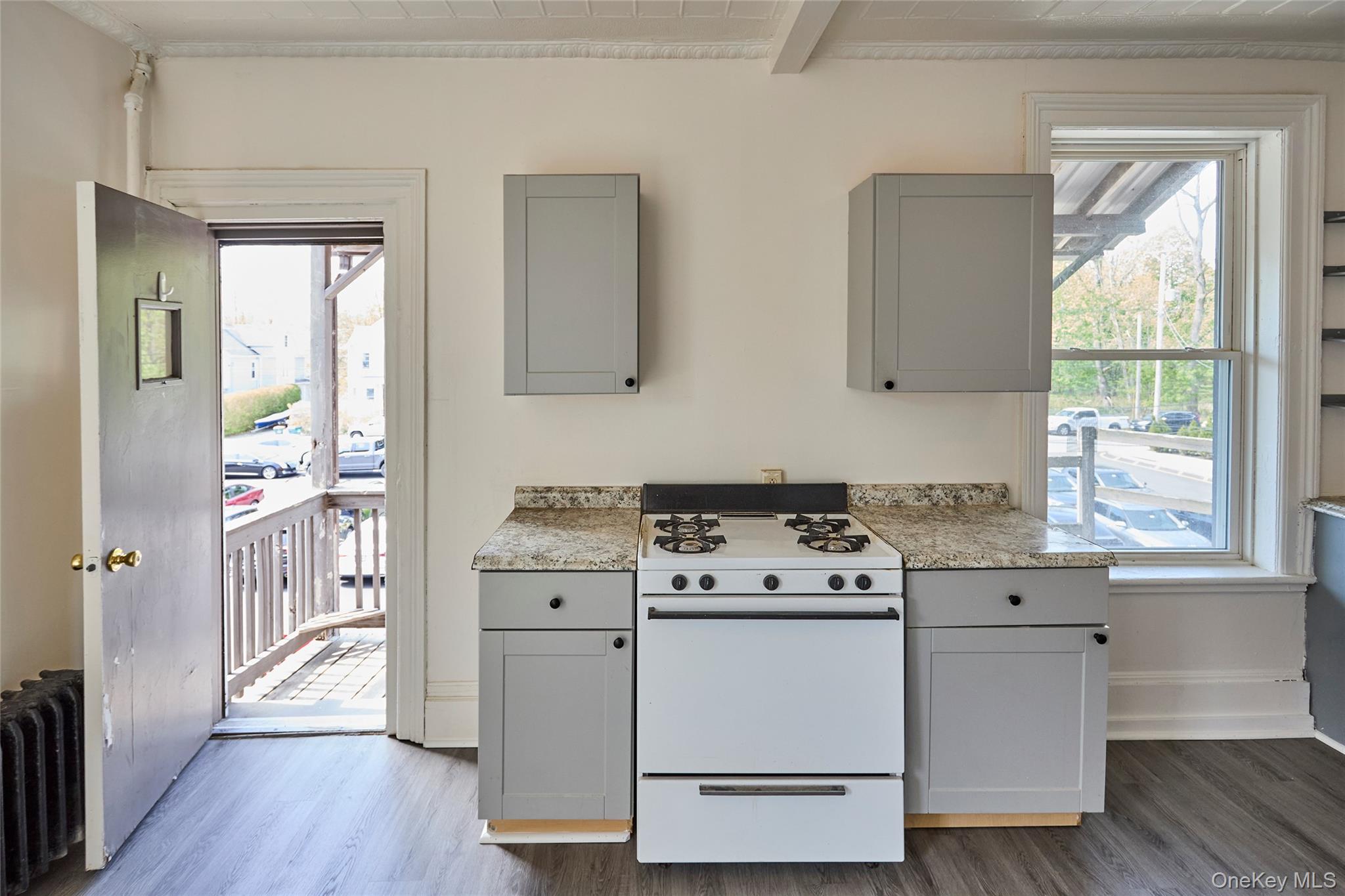 457 Main Street, Unit 3 Beacon, NY 12508 - Photo 13 of 13 a kitchen with a stove a sink and a window